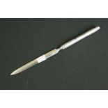 Vintage silver handled letter opener having a blade to the top with silver handle having a
