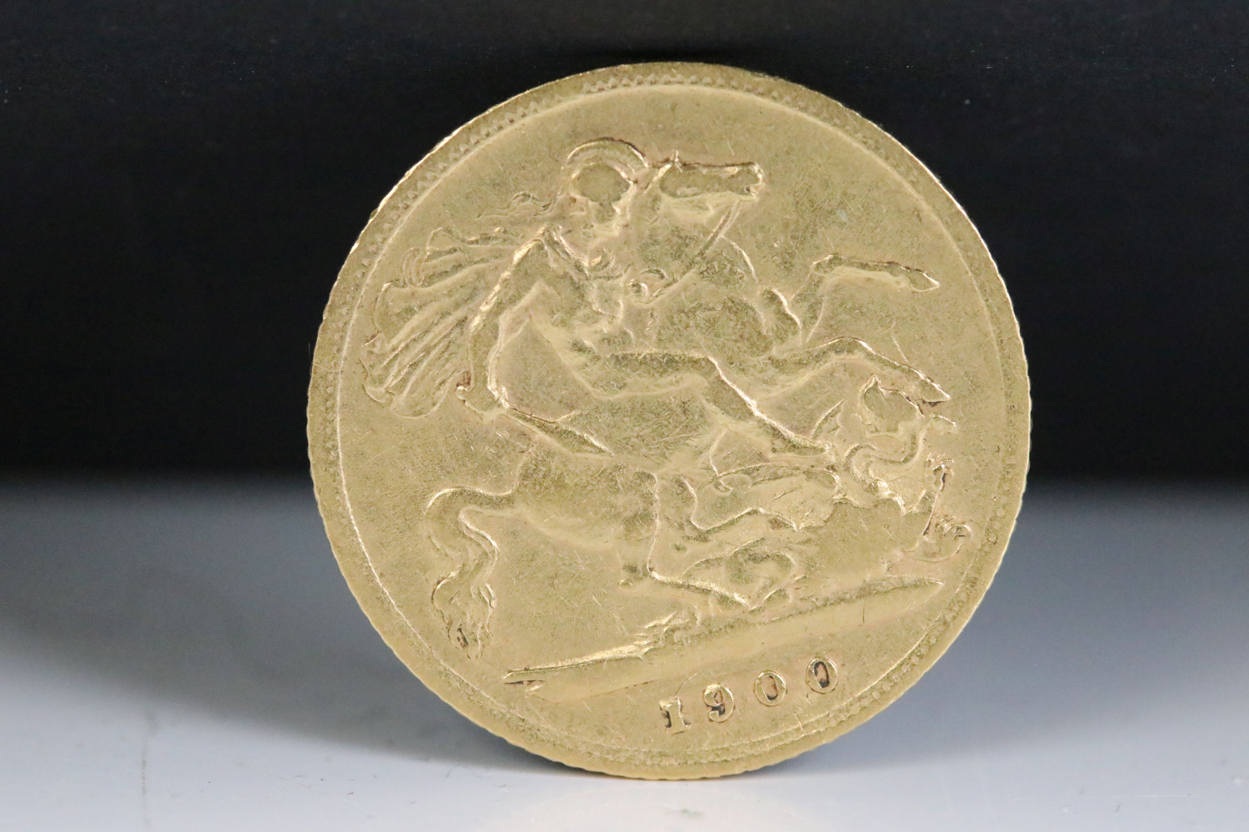 A British Queen Victoria gold half sovereign coin, dated 1900.