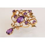 Art Nouveau style amethyst and cultured pearl 9ct gold pendant brooch, the central oval mixed cut