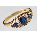 Sapphire and diamond 18ct yellow gold boat head ring, the oval mixed cut principal sapphire