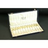 Cased set of 12 ' Lazarus Posen Witwe ' German parcel gilt silver coffee spoons, beaded border