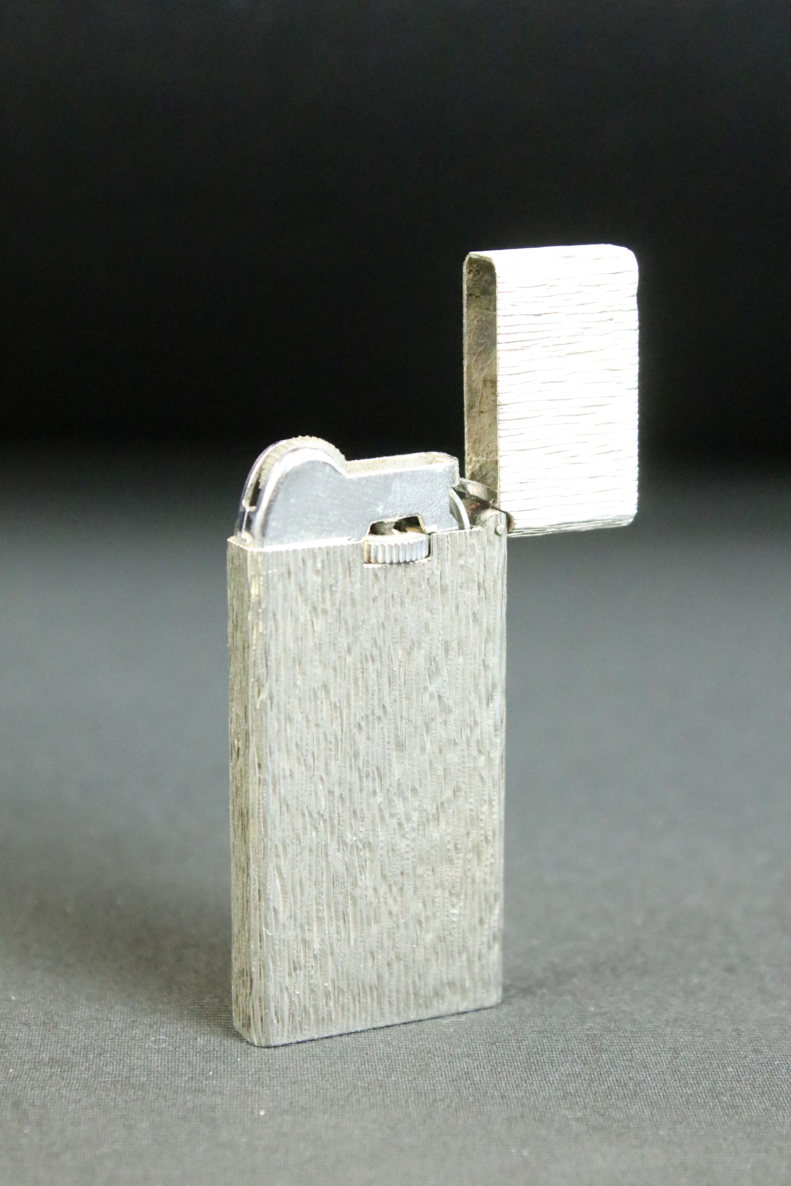 Vintage Tiffany & Co silver cigarette lighter. The lighter having textured sides with a hinged - Image 2 of 4