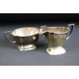 George VI Art Deco silver milk jug & twin-handled sugar bowl, of plain polished design with