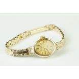 Rotary 9ct gold ladies wristwatch, oval face, baton numerals and hands, 9ct gold bracelet strap