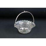 Late Victorian silver swing-handled bon bon basket with pierced border, crimped upper edge,