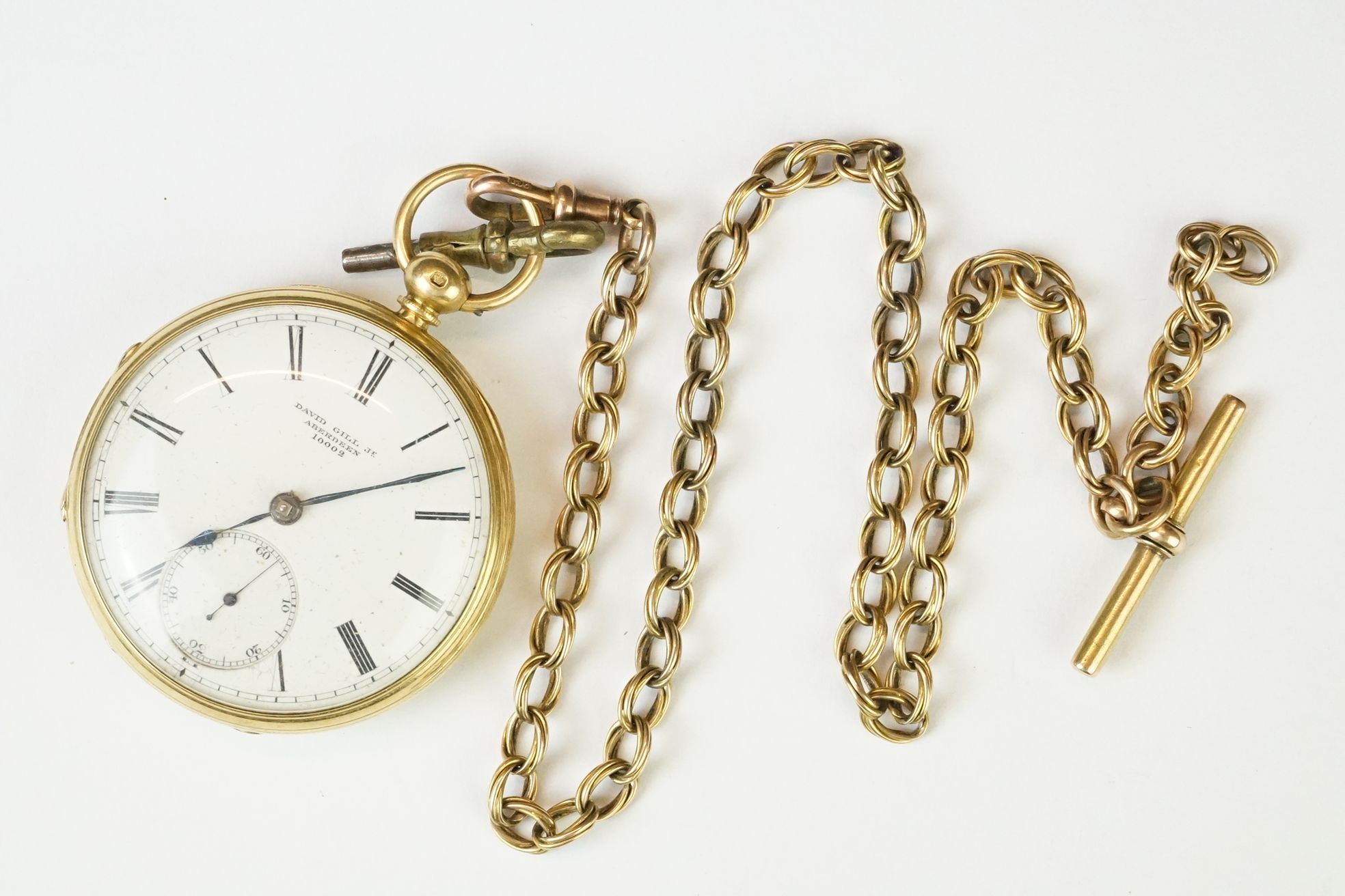 Victorian 18ct gold open face pocket watch mounted with a 9ct gold watch chain. The watch having a