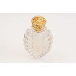 Victorian scent bottle with yellow metal hinged lid, cut glass body of flattened oval form and