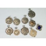 Collection of 10 silver sporting-related Albert fobs, circa 1920's / 30s, to include a 1930's fob
