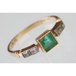 Early 20th century emerald and diamond 18ct yellow gold and platinum set ring, the centre square