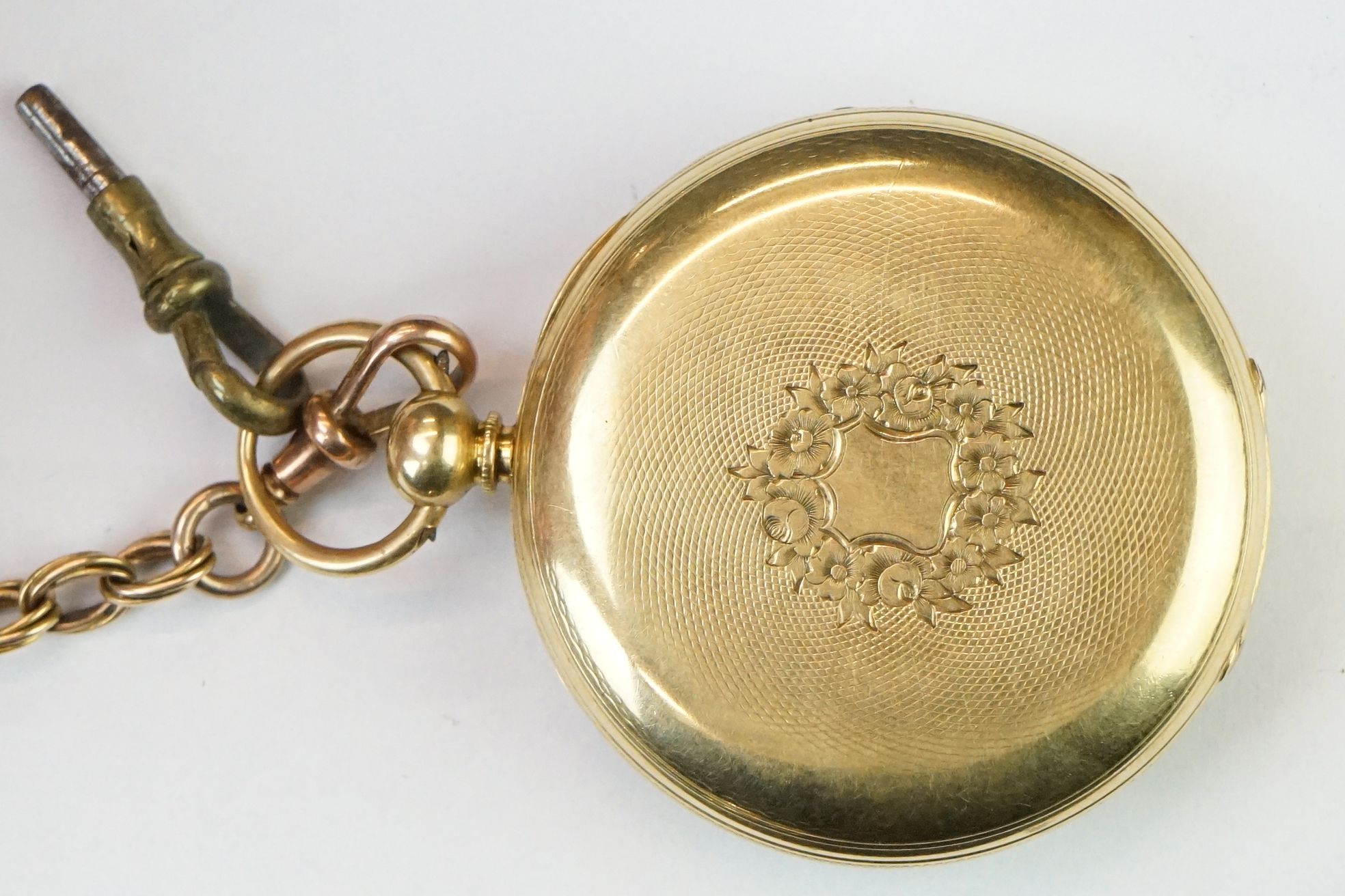 Victorian 18ct gold open face pocket watch mounted with a 9ct gold watch chain. The watch having a - Image 3 of 8