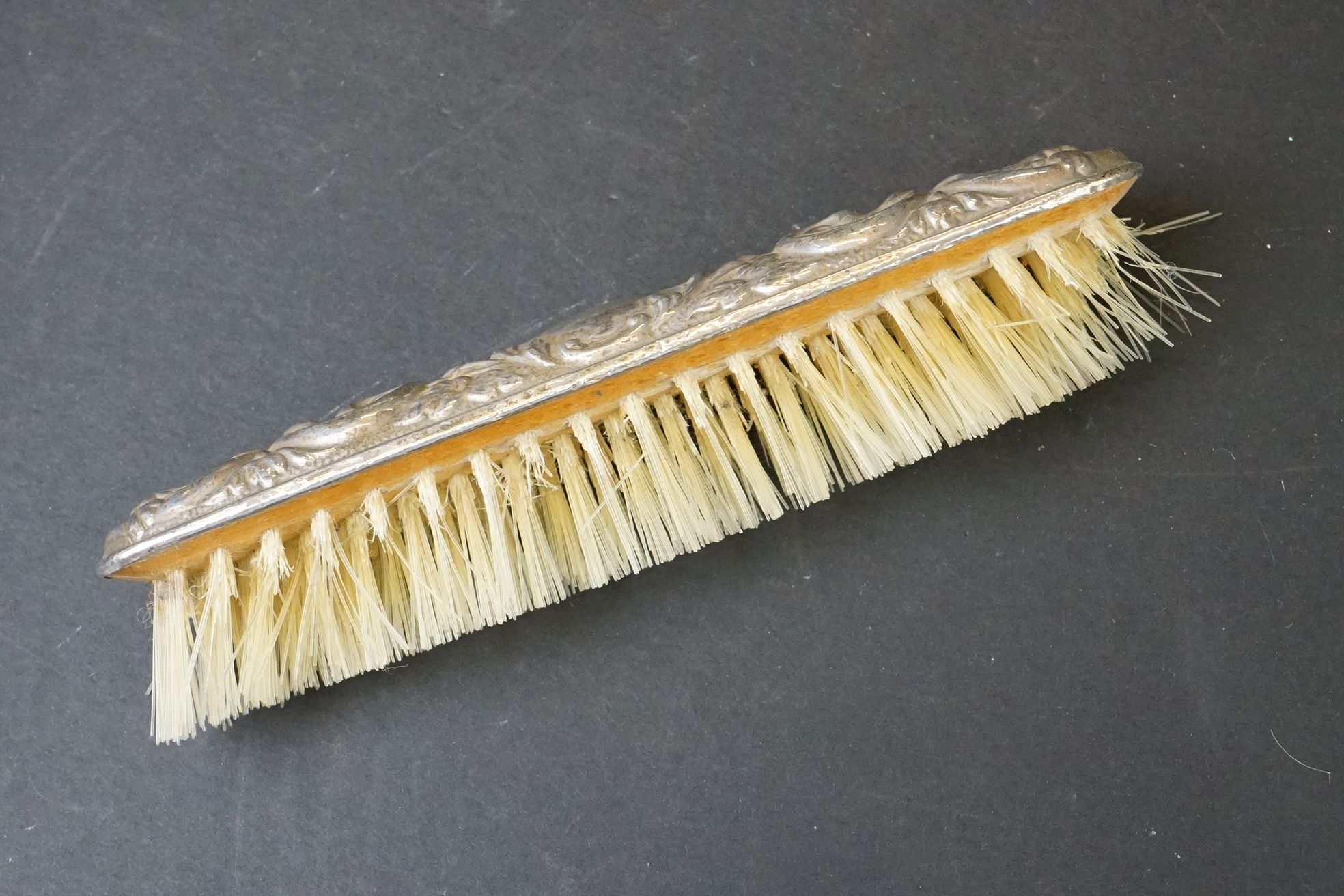 Mid 20th C silver mounted four-piece dressing table brush set with repousse Gothic-style decoration, - Image 6 of 7