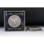 A collection of four United States of America Morgan dollars to include 1884, 1921, 1885 and a