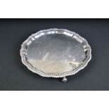 George VI circular silver salver with stepped pie crust border, gadrooned rim and plain polished