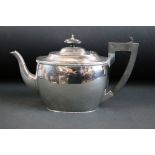 Silver teapot, plain polished body, cast decorative border, ebony angular handle and finial,