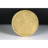 A Netherlands five Guilders gold coin, dated 1912.