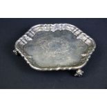 William Hutton & Sons silver salver having a moulded rim with engraved crest raised on scrolled