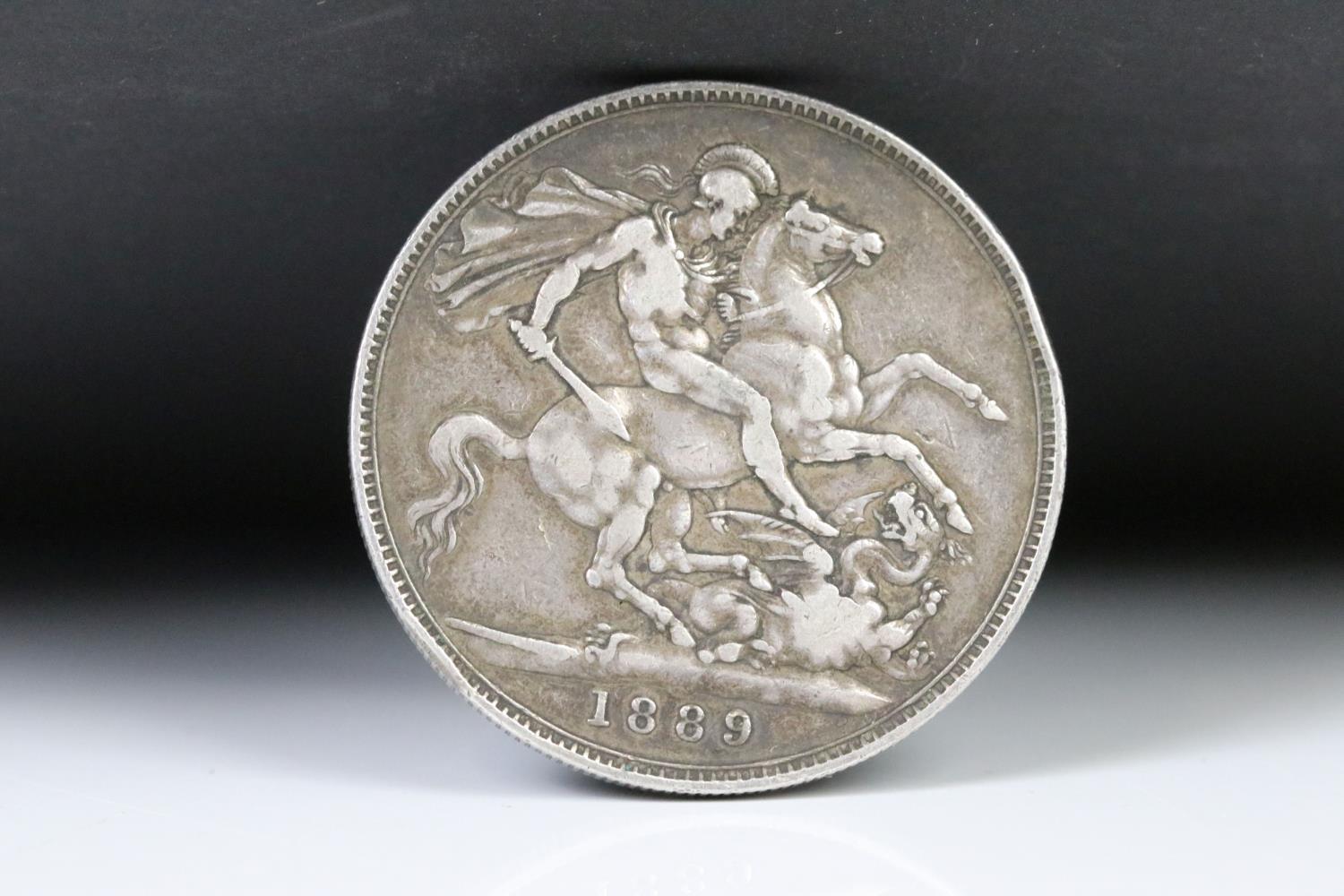 A collection of three British pre decimal silver full crown coins to include 1821, 1887 and 1889 - Image 2 of 7