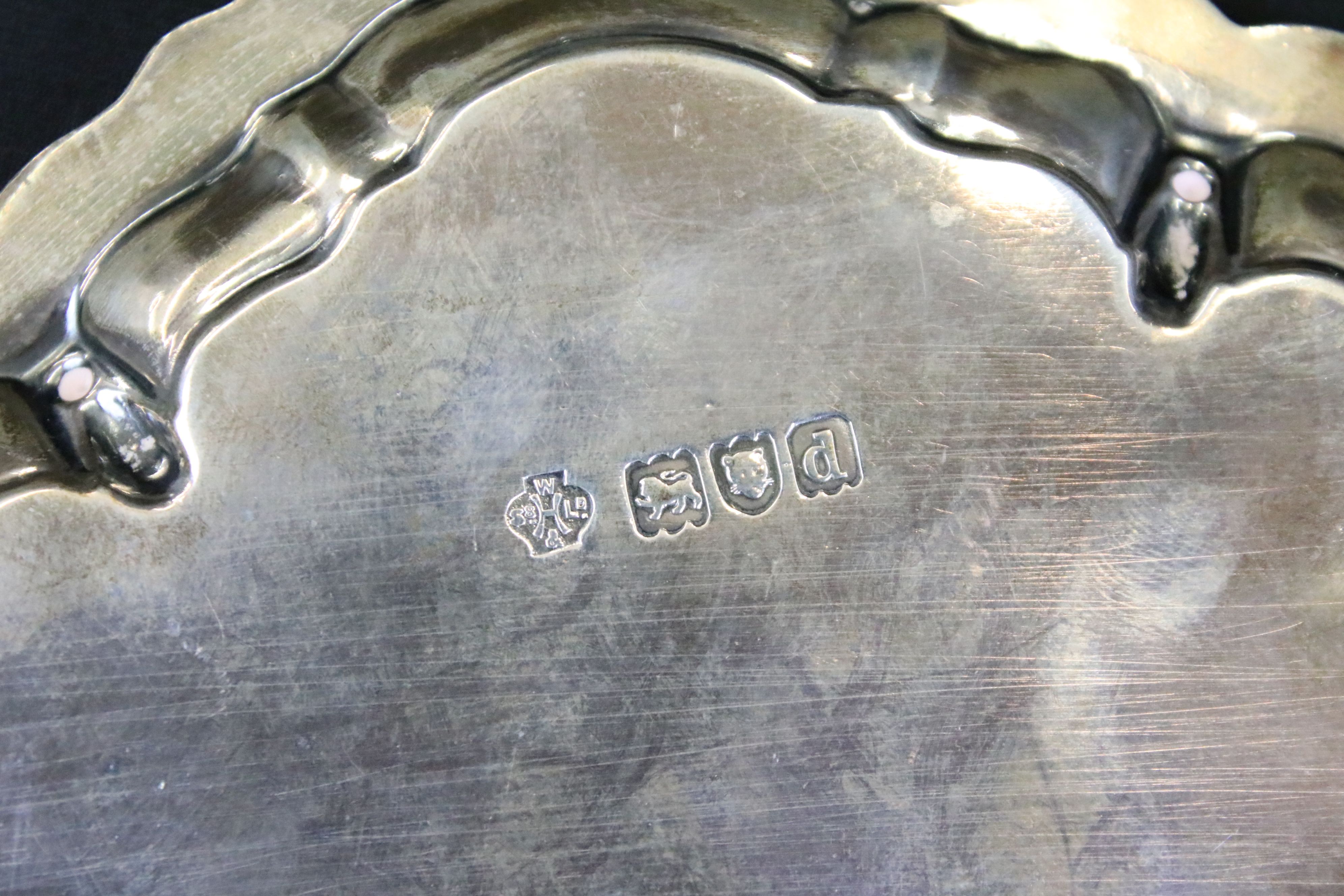 William Hutton & Sons silver salver having a moulded rim with engraved crest raised on scrolled - Image 5 of 5