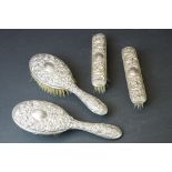 Mid 20th C silver mounted four-piece dressing table brush set with repousse Gothic-style decoration,