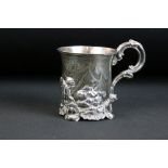 19th century silver tankard decorated with a chased repousse Alpine scene with dog and boy to