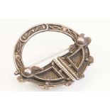 1930s silver hallmarked Celtic Scottish style brooch of roundel form with raised knot detailing.