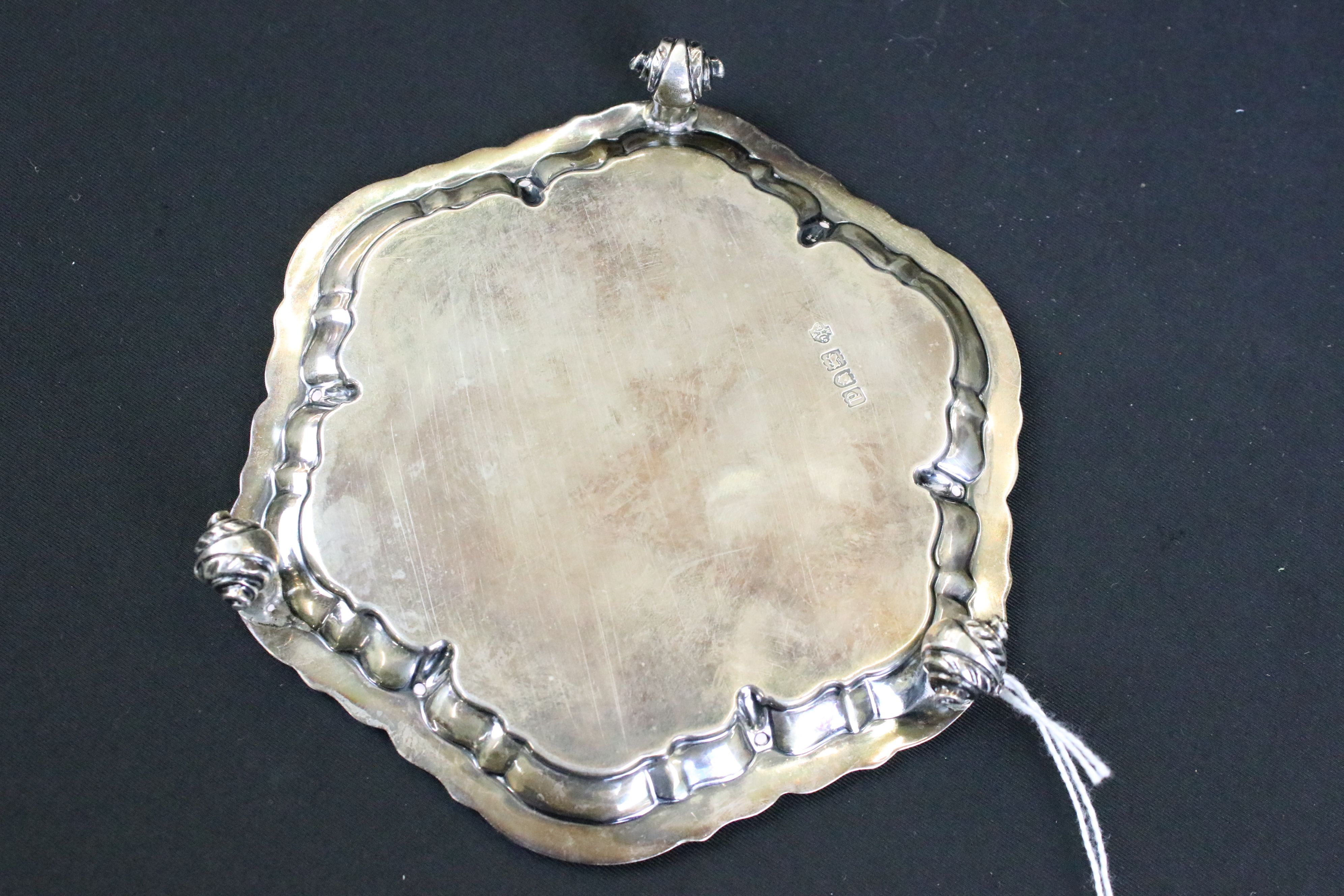 William Hutton & Sons silver salver having a moulded rim with engraved crest raised on scrolled - Image 4 of 5