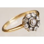 Early 20th century diamond 18ct yellow gold and silver set halo cluster ring, nine small round old