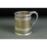 Mid 20th century silver christening mug of tapering form, with two regions of banding decoration,