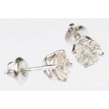 Pair of diamond solitaire 14ct white gold stud earrings, modern round brilliant cut diamond, each