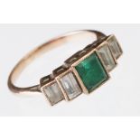 Art Deco emerald and white sapphire five stone stepped unmarked rose gold ring, the baguette cut