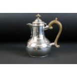 Early 20th Century silver hallmarked coffee pot of baluster form having a scrolled wooden handle and