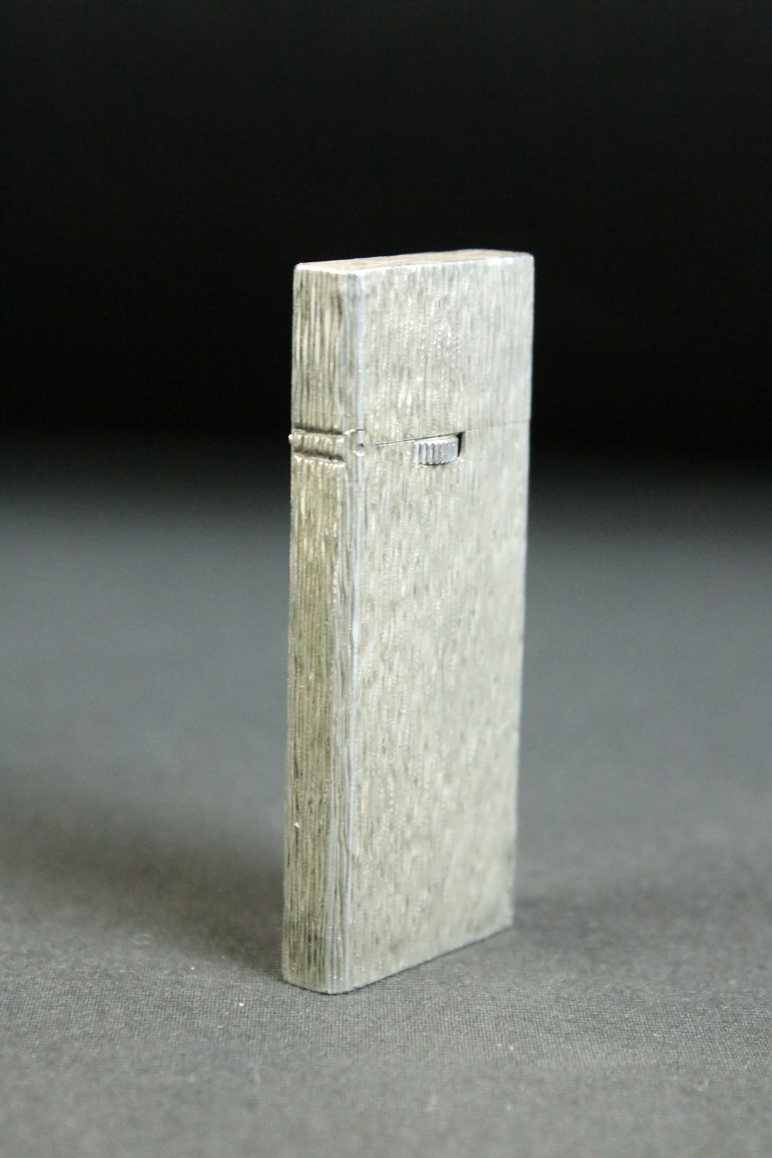 Vintage Tiffany & Co silver cigarette lighter. The lighter having textured sides with a hinged - Image 3 of 4