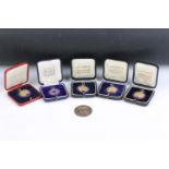A collection of five fully hallmarked sterling silver medals together with a Queen Victoria 1900