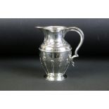 Edwardian William Aitkin silver hallmarked jug having a scrolled handle with raised neo classical