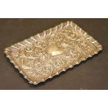 Art Nouveau silver dressing table tray with repousse decoration depicting a grotesque mask,