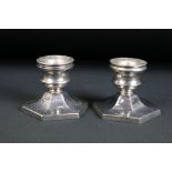 Pair of dwarf candlesticks having hexagonal bases with round sconces to the top. Hallmarked