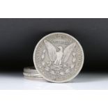 A collection of four United States of America Morgan dollars to include 1887, 1921, 1891 and a