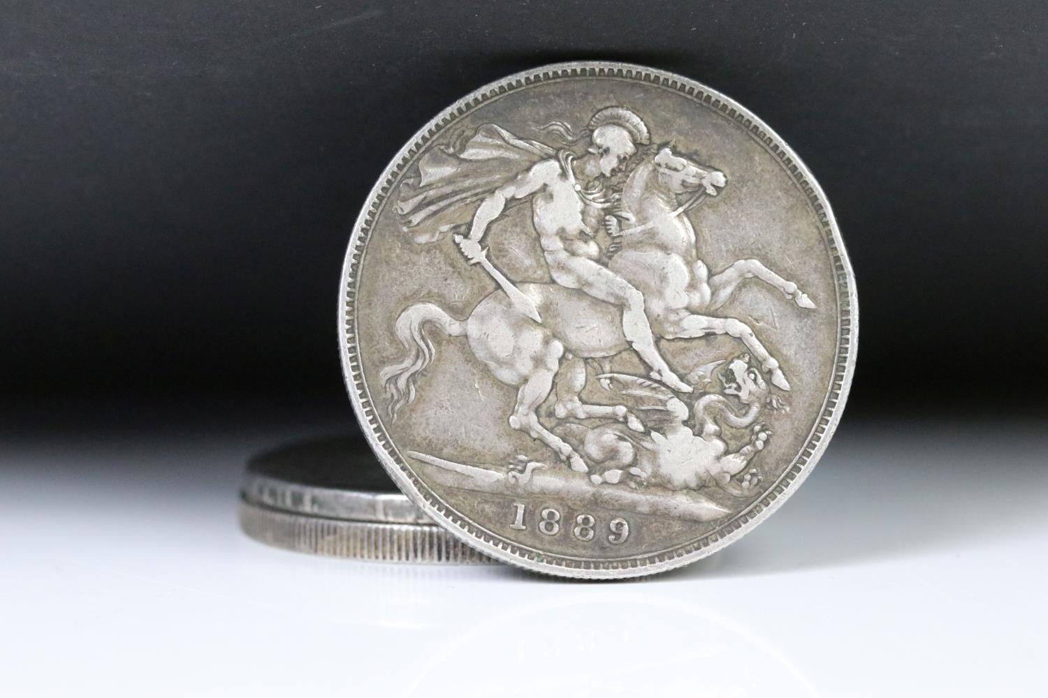 A collection of three British pre decimal silver full crown coins to include 1821, 1887 and 1889