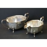 Viner's silver hallmarked sugar bowl and cream jug. Both of octagonal form raised on paw feet with