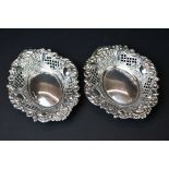Pair of 1960s silver bon bon dishes, of oval form, with repoussé floral decoration, vacant