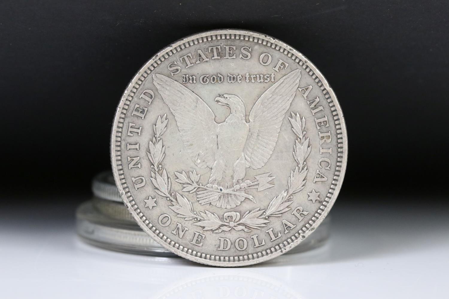 A collection of four United States of America Morgan dollars to include 1921, 1881 and two 1921