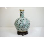 Large Chinese blue ground bottle vase, the enamel decoration depicting cranes in-flight amongst