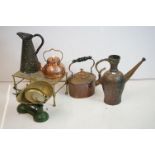A collection of mixed metalware to include a copper jug, copper kettle, brass trivet, kitchen