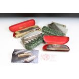 A collection of four vintage Hohner harmonicas / mouth organs to include a Chrometta 14 example.