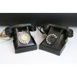 Two early to mid 20th century black home telephones one labeled 'Call Exchange'.