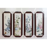 Set of four Chinese ceramic wall plaques, each depicting a different scene with figures & trees,