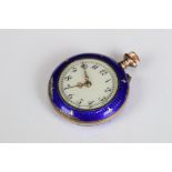 An antique ladies yellow metal fob watch with enamel and gilt decoration.