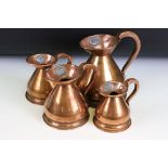 A set of four copper graduated copper jugs from 1/2 Gill through to 1 Pint, proof marks to jugs
