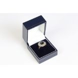 A ladies fully hallmarked 9ct gold dress ring set with garnet centre stone.