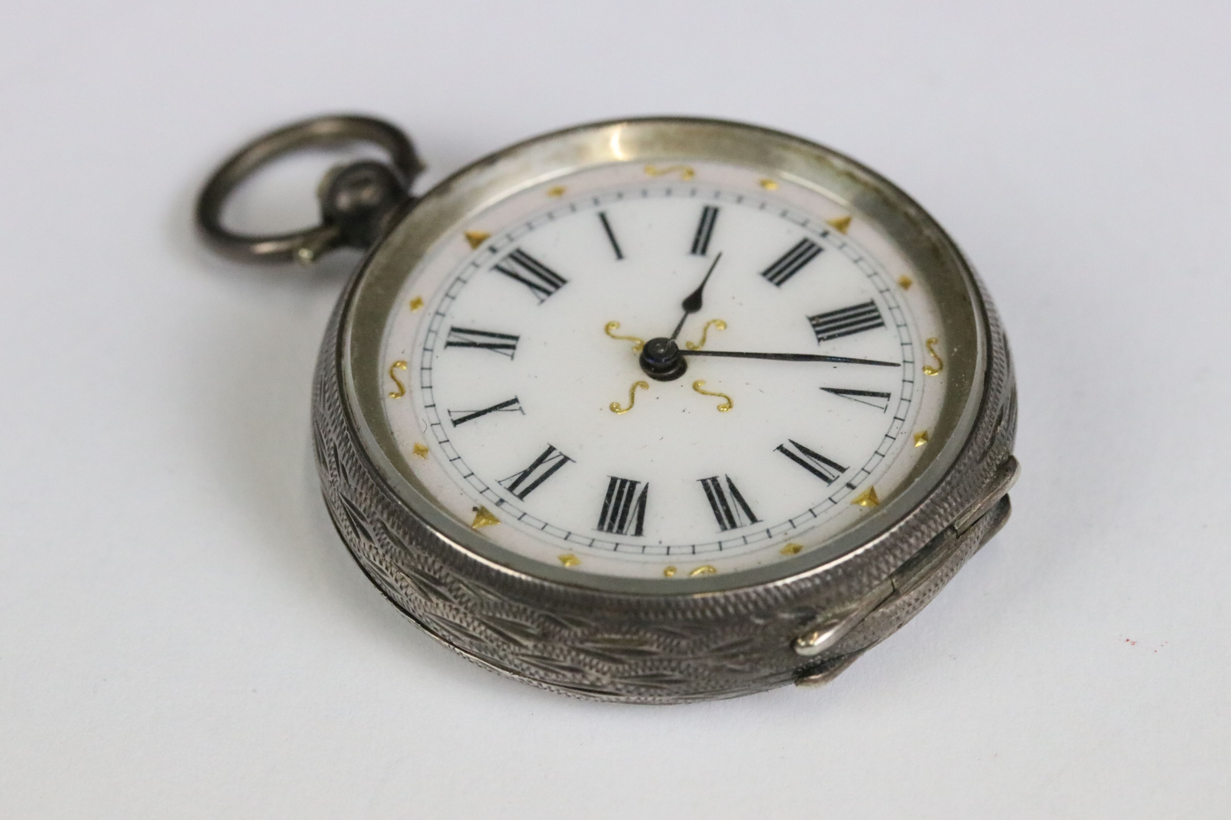A collection of three silver cased ladies fob watches, two with enamel decoration to the dial. - Image 6 of 13